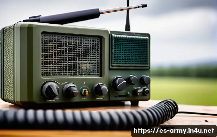 육군 무전기 사용법 - A detailed close-up of a military radio communication setup on a rugged field desk, featuring a tact...
